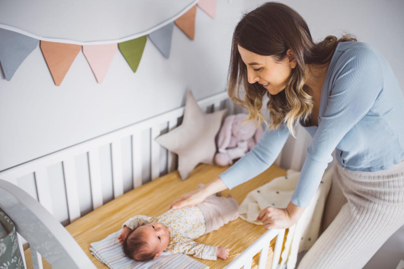 Baby settled and sleeping in crib after being put down
